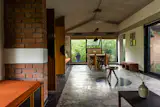 While weaving in the programmatic requirements of a home-like workspace, the built fabric consciously reduces footprint and uses orientation and axis to its climatic advantage. 