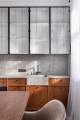 Modern kitchen by ZROBIM architects with wooden fronts and interesting details.