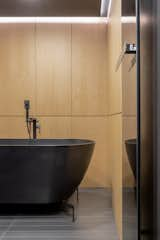 Bath Room, Wood Counter, Ceiling Lighting, Travertine Floor, Open Shower, and Floor Lighting  Photo 13 of 32 in RE APARTMENT by ZROBIM architects