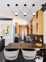 A sleek and modern kitchen perfect for home-cooking and hosting. 