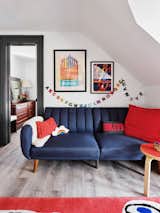 Colorful, welcoming design elements add to the comfort of the attic playroom/guest area. 