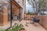 Ground Floor terrace where you can see that all the colors and materials of the building were chosen after the earth toned color of the concrete walls.