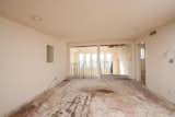 Before: Low ceiling storage at the basement level