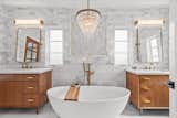 After: without altering existing window locations, the master bathroom layout was reconfigured to fit two vanities, a tub and a good size shower