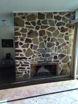 Original stone fireplace in Vista House by Fabrikate