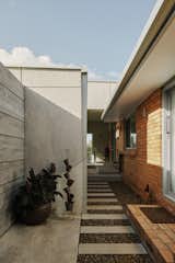 Bringing the garage to street level allowed Hyde to create a secure entry to the house for Carmen.