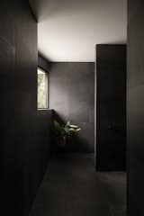 The dark bathrooms feel luxurious without being fussy.