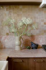 The pink Breccia Damascata marble bench top paired with shimmering caramel zellige tiles reflects Nicole's sense of maximalism. "I grew up in a family of maximalists—artists, collectors, and creators,