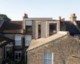 A Brick and Glass Extension Telescopes Out Across the Roof of a London Home