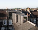  Photo 3 of 11 in A Brick and Glass Extension Telescopes Out Across the Roof of a London Home from Stepped Loft