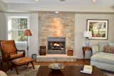 Living Room, Dark Hardwood Floor, and Gas Burning Fireplace Stone Fireplace   Photo 1 of 7 in Lake Champlain Open Concept Lake House by JoAnna Giltner