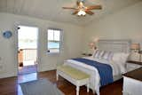 Primary Bedroom with waterside deck  Photo 6 of 7 in Lake Champlain Open Concept Lake House by JoAnna Giltner