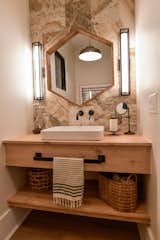 Bath Room, Wall Lighting, Medium Hardwood Floor, Pendant Lighting, Vessel Sink, Stone Tile Wall, and Wood Counter Natural elements in half bath.  Photo 8 of 19 in White Rock by Jenny Pippin