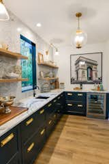 Kitchen, Granite Counter, Drop In Sink, Wine Cooler, Pendant Lighting, Medium Hardwood Floor, Mosaic Tile Backsplashe, Wall Lighting, Colorful Cabinet, and Wood Cabinet Scullery.  Photo 17 of 19 in White Rock by Jenny Pippin