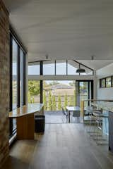 Dining Room, Chair, Shelves, Bench, Ceiling Lighting, Pendant Lighting, and Light Hardwood Floor  Photo 10 of 15 in Glen Iris House by Jost Architects