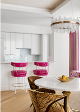 Kitchen, Marble Counter, Undermount Sink, Refrigerator, White Cabinet, Light Hardwood Floor, Recessed Lighting, and Glass Tile Backsplashe Kitchen  Photo 4 of 6 in Passion in Pink by Leslie Nelson