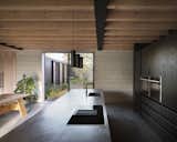 Kitchen, Wall Oven, Pendant Lighting, Drop In Sink, Metal Counter, and Concrete Floor  Photo 6 of 22 in Derwent Valley Villa by Blee Halligan