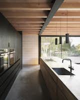 Kitchen, Wall Oven, Concrete Floor, Pendant Lighting, Drop In Sink, and Wood Cabinet  Photo 7 of 13 in Nelson by Louise Foley from Derwent Valley Villa