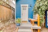 Outdoor, Front Yard, Flowers, Wood Fences, Wall, Hanging Lighting, Shrubs, Decking Patio, Porch, Deck, Small Patio, Porch, Deck, and Vertical Fences, Wall  Photo 8 of 23 in The Monta-Villa Garden Cottage and Guesthouse by Brian Stafki