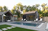 Outdoor, Large Pools, Tubs, Shower, Back Yard, Hardscapes, Trees, Grass, and Vertical Fences, Wall Modern backyard for Boulder, CO family   Photo 1 of 13 in Modern Boulder Backyard with Pool House by Yardzen