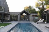 Outdoor, Large Patio, Porch, Deck, Concrete Patio, Porch, Deck, Back Yard, Stone Patio, Porch, Deck, Large Pools, Tubs, Shower, and Pavers Patio, Porch, Deck Modern backyard for Boulder, CO family   Photo 5 of 13 in Modern Boulder Backyard with Pool House by Yardzen