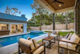 View of multi purpose area  and pool from main house porch.  Spaced to keep everyone connected.