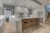 Kitchen with glass door open to butler pantry