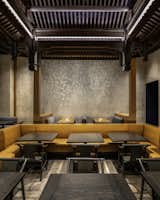Finishes and design details pay homage to Xiong’s countryside homeland in Chengdu. Palette of inky blacks and natural woods. Multi-layered Venetian plaster with raised ginkgo stencil; Hand-carved details by Houston-based Carissa Marx. 
