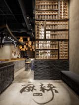 Over-scale Chinese abacus styled partition & Chinese character shadow art at entry. 
