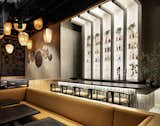 Dining Room, Ceiling Lighting, Stools, Bar, Accent Lighting, Table, Wall Lighting, and Recessed Lighting View of backlighted bar area and hanging lantern display  Photo 11 of 14 in Mala Sichuan M-K-T Houston by MIMI PR