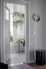 The bathroom was conceived as a limbo-environment deliberately disconnected from the rest of the house on a stylistic level. Characterized by marble grit coverings, opaque black taps and by the large shower with an arched entrance, a space for meditation and relaxation. The atmosphere is completed by the intense presence of plants to create a small urban jungle in the heart of the city.

Floor and shower coverings by Mariotti Fulget
Fabula Stories shelves  Photo 17 of 20 in Fabula's house by Vania Viscardi