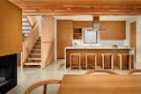 Kitchen, Marble Counter, Concrete Floor, Wood Cabinet, Stone Slab Backsplashe, and Ceiling Lighting Timeless and clean kitchen with stunning millwork  Photo 6 of 10 in Old Strathcona House by Gillian Thomson