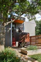 Garage suite stairway is a focal point in the backyard