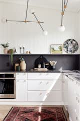 Black & White modern kitchen in renovated Southcott home 