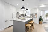 Kitchen  Photo 11 of 16 in Comfortable, Contemporary Living: High Street Rowhomes at Southlands by PUBLiSH