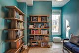 Living Room, Shelves, Rug Floor, Sofa, Ottomans, Floor Lighting, End Tables, Ceiling Lighting, Lamps, and Light Hardwood Floor Swiss Library  Photo 17 of 20 in O Street Project by Virginia Bou