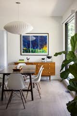 Dining Room, Chair, Medium Hardwood Floor, Ceiling Lighting, Recessed Lighting, Storage, and Table  Photo 13 of 14 in Modular Modern Farmhouse by Hoke Ley