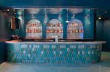 Bar.
- Custom soffit with water metal ripple, Geneva model by G-Tex (UK)
- Wall: silver micro-cement by Ciment Art
- Counter: Calathea tile by Acquario Due (Italy)
- Counter top: Mediterranean Blue marble by ABC Stone
- Lights: N55 by Viabizzuno