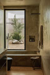 Minimalist design bathroom perfectly warmed by the outside landscape   