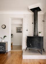 Living Room, Medium Hardwood Floor, and Wood Burning Fireplace  Photo 4 of 11 in 2075 Syracuse Street by Fantastic Frank