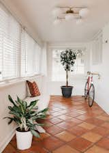 Hallway and Terra-cotta Tile Floor  Photo 3 of 13 in Park Hill Bungalow by Fantastic Frank