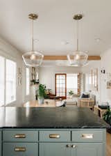 Dining Room, Medium Hardwood Floor, Pendant Lighting, and Table  Photo 6 of 13 in Park Hill Bungalow by Fantastic Frank