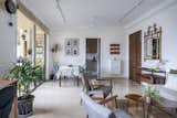 The space was re-oriented to have the dining table closer to the kitchen, facing the balcony 