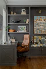 A custom upholstered bench with gorgeous brown leather straps for an extra textural touch to round out the space and bring in some pattern. 