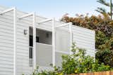 Exterior, ADU Building Type, and Saltbox RoofLine Private entrance to the ADU with white metal louvers for privacy.  Photo 1 of 10 in SM20 - Santa Monica ADU by F-ARE 