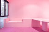 Soft pink furniture invites visitors to stay