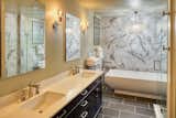 Bath Room, Wall Lighting, Enclosed Shower, Freestanding Tub, Pendant Lighting, and Marble Wall Bathroom  Photo 3 of 6 in FOR SALE: Mid-Century Modern Treasure by Lauren Ashley