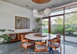 Dining Room, Table, Storage, Chair, Ceiling Lighting, and Limestone Floor  Photo 11 of 31 in Introducing The Monolithic House by Aditi Doshi
