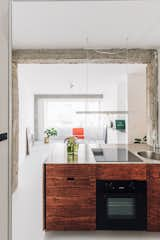 Kitchen, Metal Cabinet, Pendant Lighting, Wood Counter, and Ceiling Lighting View of the living room from the kitchen  Photo 6 of 17 in Hotel des Monnaies by Beatrice Colaiacomo