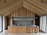 Proprietary pine trusses make up three-quarters of the roof structure, allowing the more expensive LVL to be contained to the kitchen and living areas